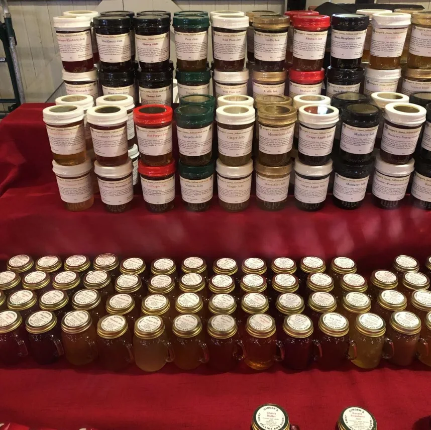 Rows of jams and jellies on the market table